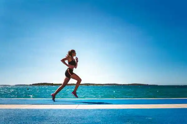 Woman running showing strong leg muscle Hockley